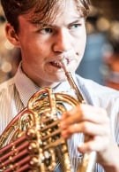 Melbourne Grammar School boy playing french horn